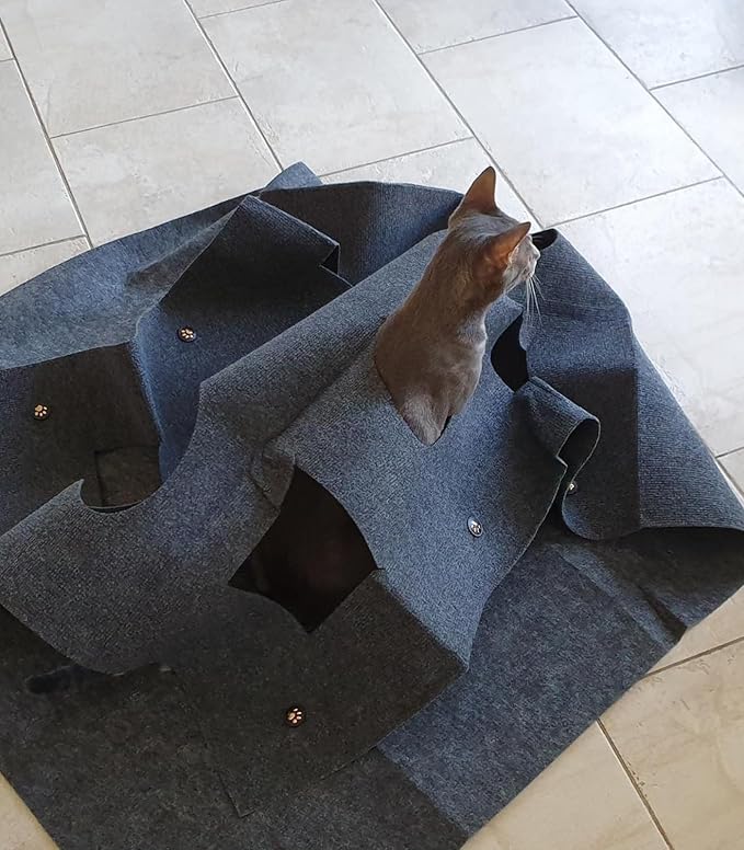 Grey cat peeking through hole in Kovapet modular felt activity mat
