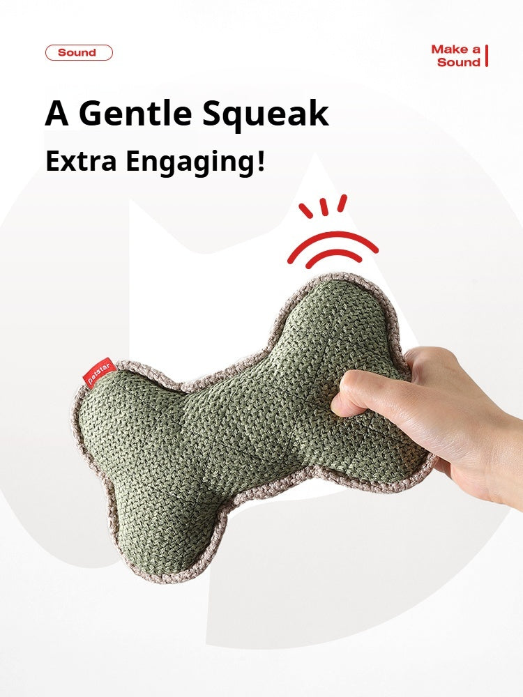 Green squeaky dog bone toy made of textured fabric